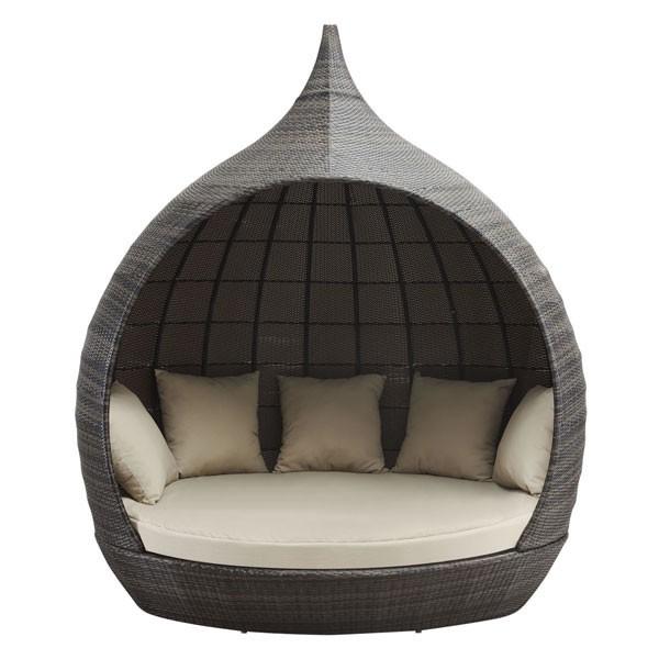 Modern outdoor chair with a textured wicker design and cushions on a white background